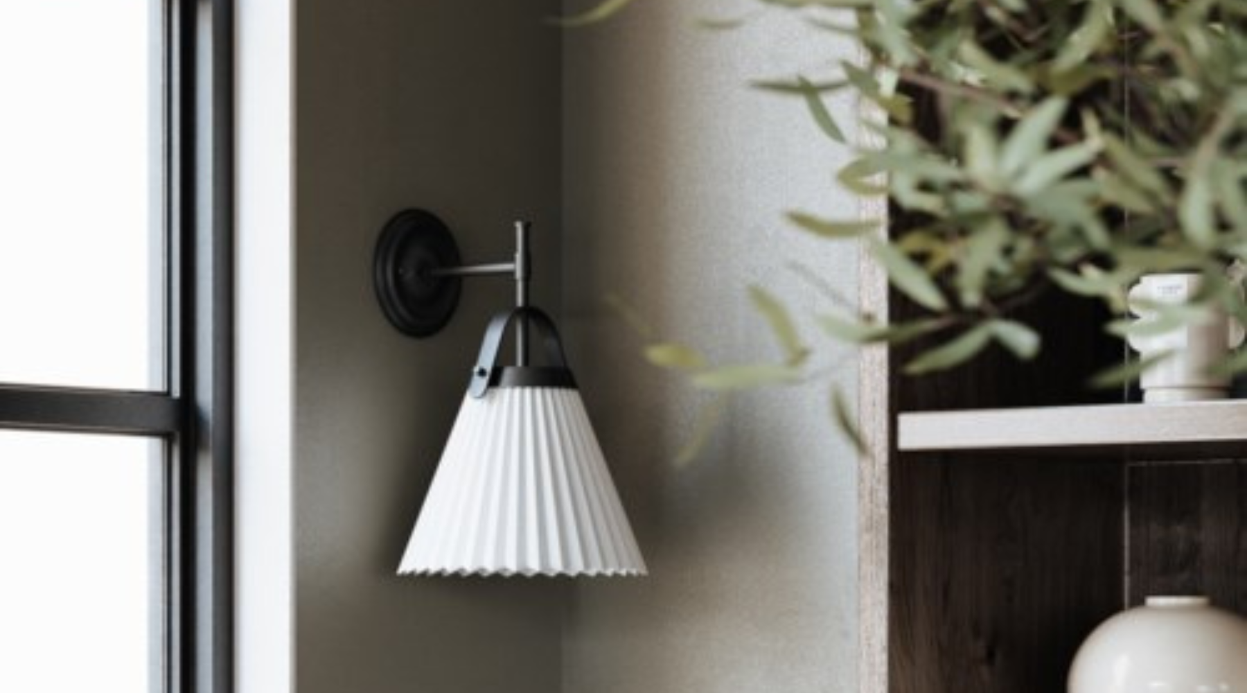 Kismet wall sconce by Maxim Lighting in gold with pleated white shade