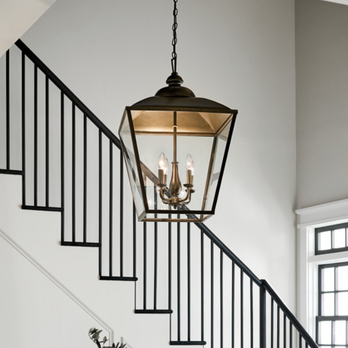 Black lantern in a tall home foyer