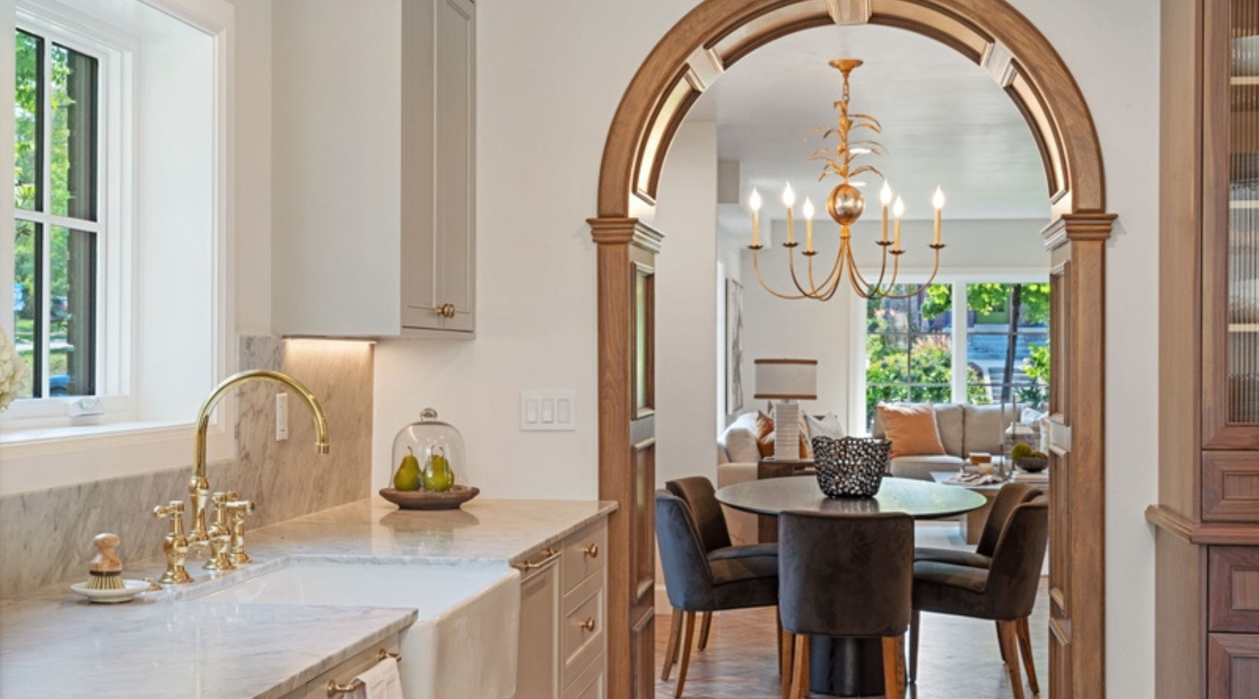 Arch showing a dining table and chandelier over the table