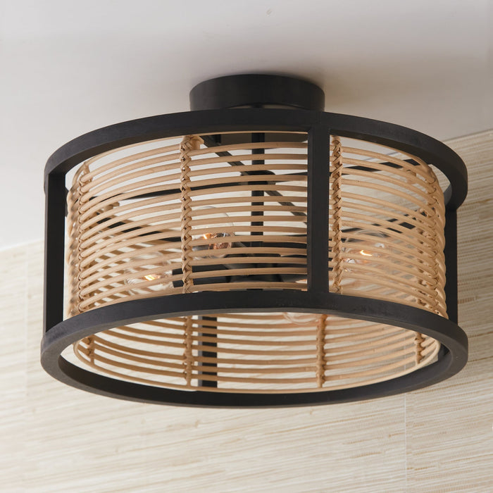 Round semi-flush ceiling light fixture with a black metal frame and woven light wood/rattan drum shade encasing visible Edison-style bulbs.
