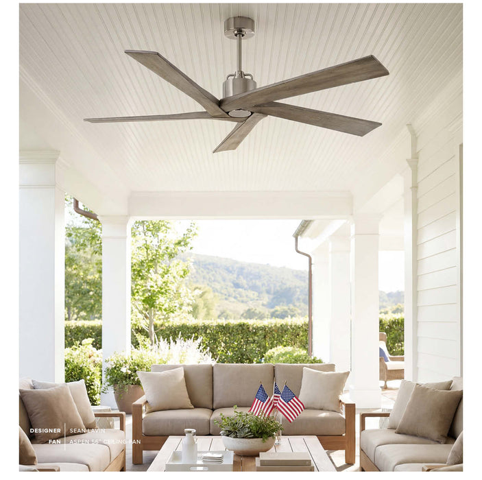Ceiling fan in a sunlit outdoor living area with furniture and decor.