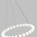 Modern chandelier with white spherical bulbs on a gray background