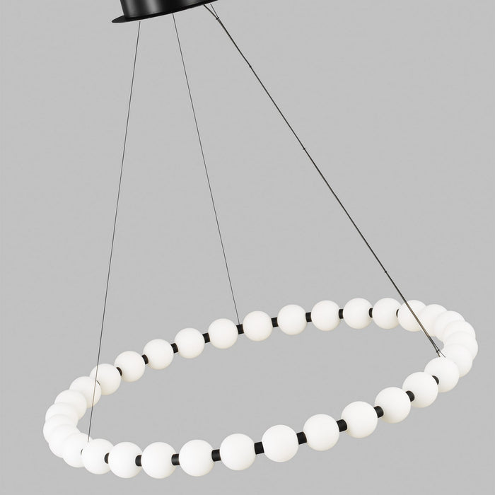 Modern pendant light with white spherical bulbs on a gray background