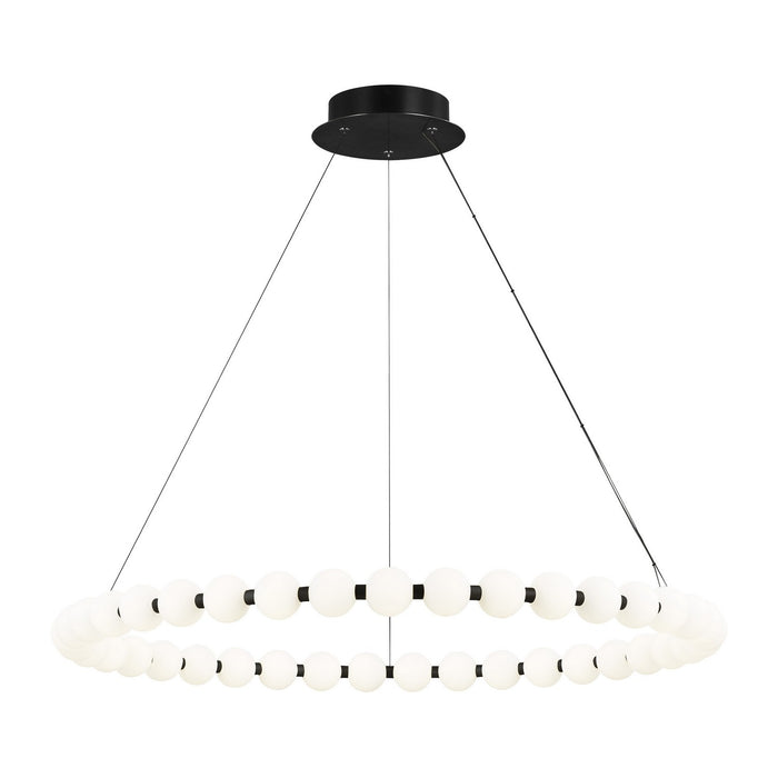 Black light fixture with wire cords holding a black ring with white glass