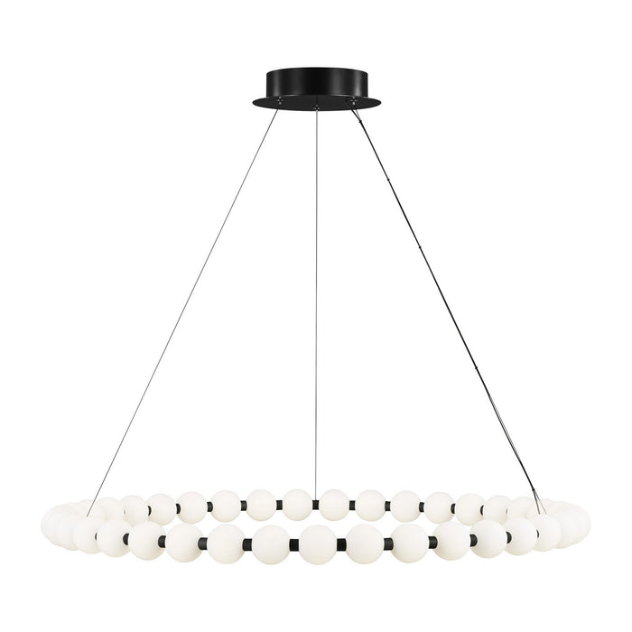Black light fixture with wire cords holding a black ring with white glass