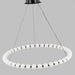 Circular chandelier with frosted globe lights suspended from a black ceiling mount by thin cables.