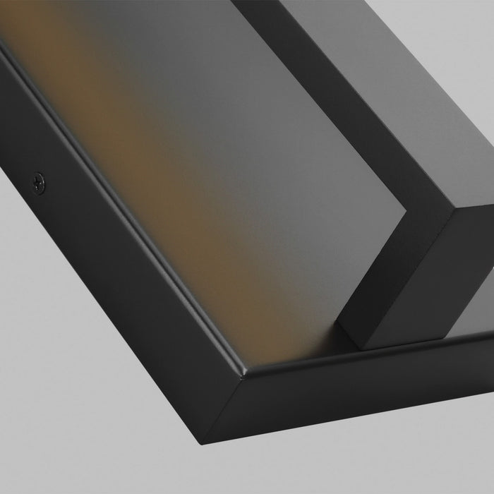 Close up image of an exterior modern rectangle pull handle light in a black finish.