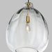 Clear glass pendant with brass accents.