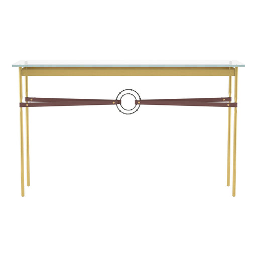Close-up view of the same console table showing yellow-gold frame and brown leather cross strap detail under the glass top.