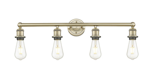 Edison Four Light Bath Vanity Antique Brass