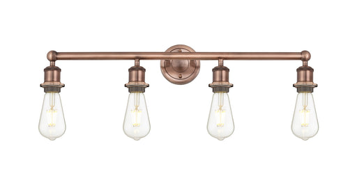 Edison Four Light Bath Vanity Antique Copper