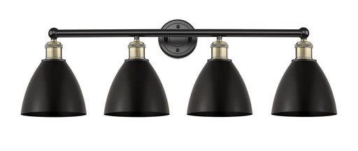 Edison Four Light Bath Vanity Black Antique Brass