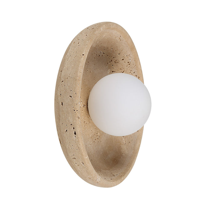 Wall light with a round white globe set in a curved beige stone frame.