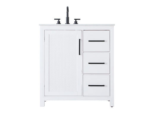 A white bathroom vanity with a black faucet and handles