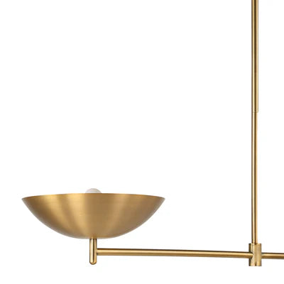 Close-up of a modern brass chandelier arm with a shallow bowl shade and exposed globe bulb.