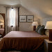 California modern cozy bedroom featuring warm terracotta bedding, soft neutral walls with vertical paneling, layered pillows, ambient table lamps, sheer curtains, framed artwork, and natural textures creating a warm and inviting bedroom retreat.