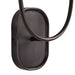 Close-up of a dark bronze wall sconce backplate with curved metal arm detail.