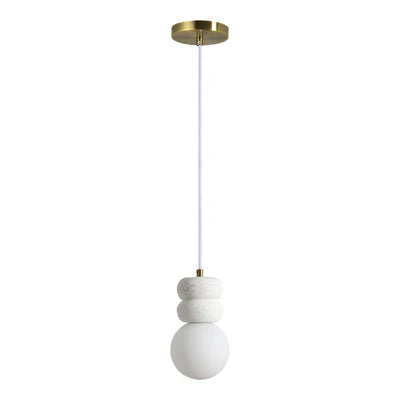 Modern pendant light with stacked white stone accents and a round frosted glass globe.