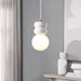Contemporary interior with a pendant light featuring stacked white stone accents and a glowing frosted glass globe.