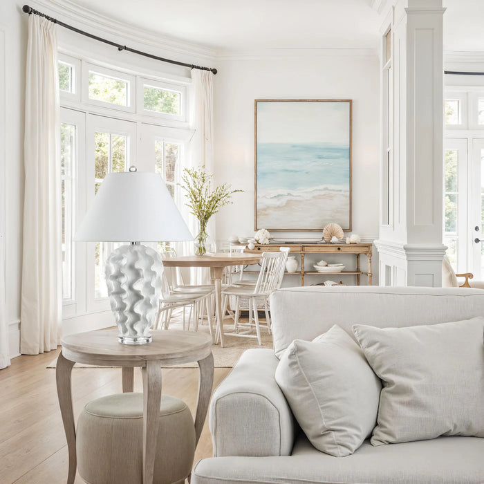 Living room with a sofa, side table, and wall art