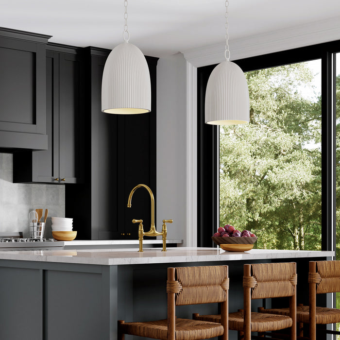 Modern kitchen with gray cabinets, white countertops, and wooden chairs.