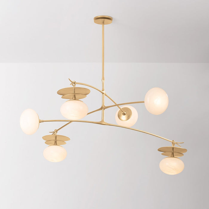 Modern gold chandelier with glass shades on a gray background