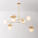 Modern gold chandelier with glass shades on a gray background