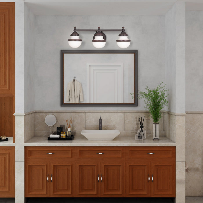 Livex Lighting - 5713-67 - Three Light Bath Vanity - Oldwick - Hand Applied Olde Bronze