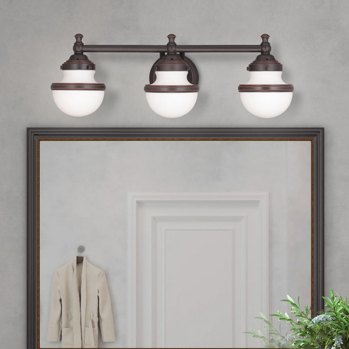 Livex Lighting - 5713-67 - Three Light Bath Vanity - Oldwick - Hand Applied Olde Bronze