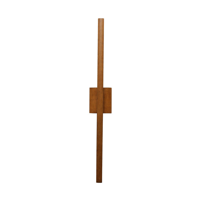A minimalist wall-mounted wooden light fixture with a vertical bar and a rectangular block, shown against a plain white background.