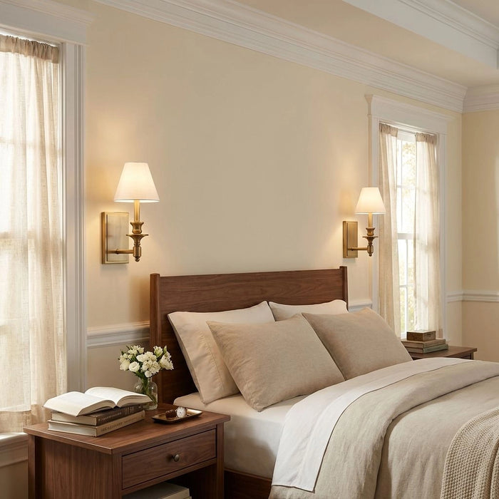 Neatly made bed in a bedroom with wooden headboard and nightstands.