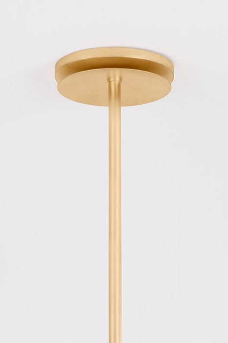 Gold pendant light fixture on a white background