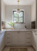 Modern kitchen with white cabinets, a sink, and a window.