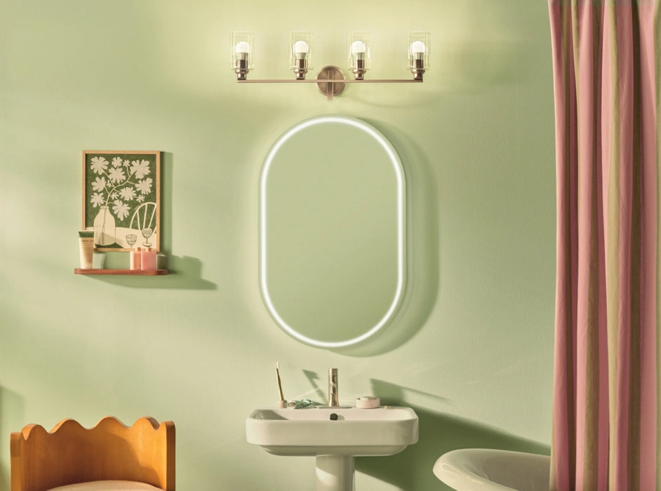 Bathroom interior with a sink, mirror, and wall light fixture on a green wall.