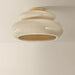 Ceiling light fixture with beige and gold design on a plain background