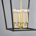 Modern lantern with gold accents and clear glass shades on a gray background