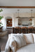 Living room with a view of a kitchen in a modern home.