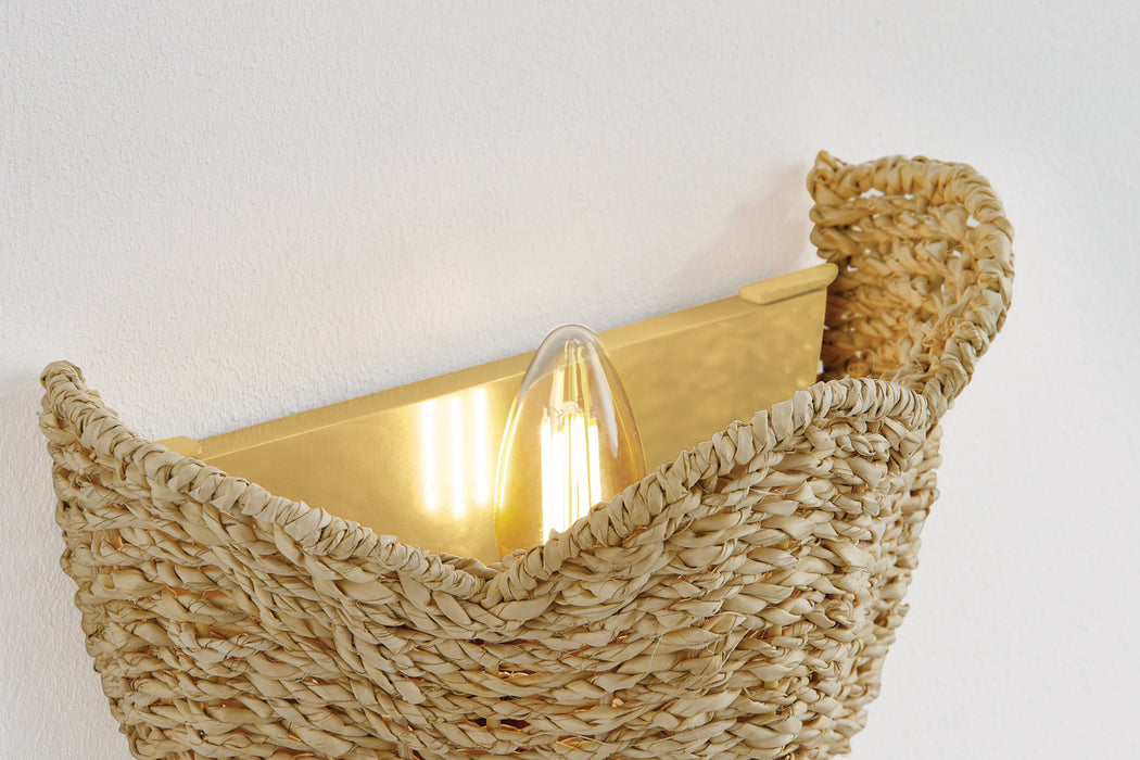 Woven basket sconce with a gold interior  against a white background