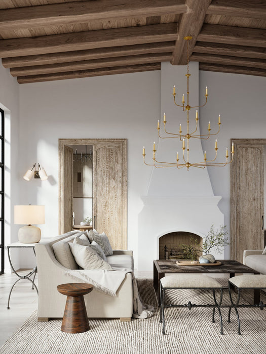 Living room with wooden beams, a chandelier, and a fireplace.