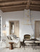 Living room with wooden beams, a chandelier, and a fireplace.