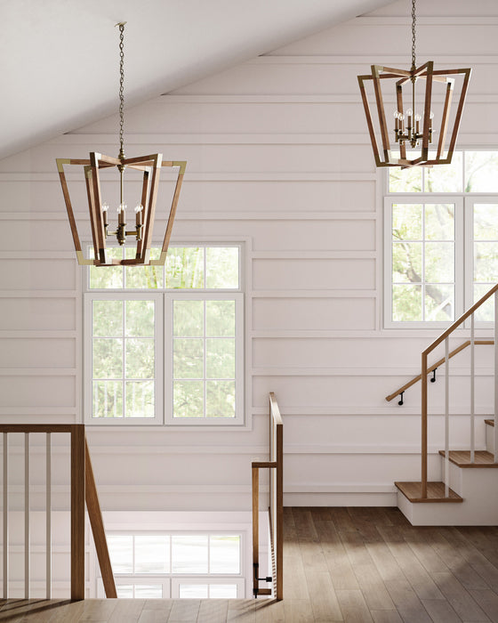 Staircase with wooden railings and pendant lights in a well-lit room with large windows.
