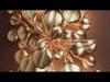 Wall-mounted sconce in a vintage gold leaf finish, designed with botanical inspiration resembling eucalyptus leaves. The sculpted metal forms branch outward in layered, leaf-like shapes, creating texture and movement. The light casts a warm, ambient glow that reflects off the metallic surface, highlighting the organic details and enhancing the nature-inspired design.