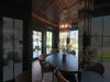 Contemporary room featuring a decorative light fixture as the main focal point. The fixture emits a soft, warm glow that spreads evenly across the space. The surrounding interior includes modern furnishings, clean lines, and a neutral color palette, creating a calm and inviting atmosphere. The camera moves slowly, showing both detailed views of the fixture and wider angles of how the lighting enhances the room