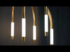 Chandelier-style light fixture featuring an integrated LED light source paired with etched cloud glass shades that softly diffuse illumination into a gentle, even glow. The glass has a subtle, cloudy texture that adds depth and visual softness. Vintage polished brass accents provide a warm metallic contrast, enhancing the refined, modern design while casting ambient light throughout the space.