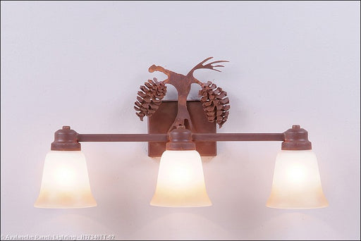 Avalanche Ranch - H37340TT-02 - Bathroom Fixtures - Three Lights - Parkshire-Spruce Cone - Rust Patina